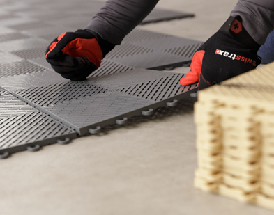 Ribtrax Pro Smooth grey tiles being installed