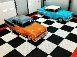 Black and White Checked Swisstrax Tiles with Two Colorful Sports Cars Parked
