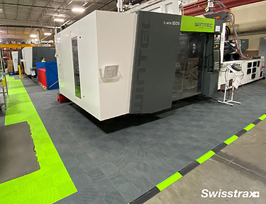 Heavy machinery on top of Swisstrax floor tiles