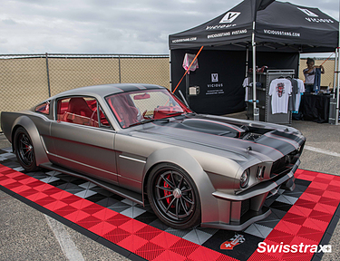 Swisstrax garage floor mats used at a car show display booth