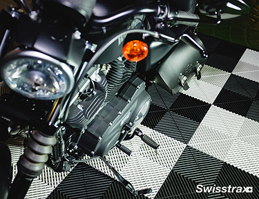 Classic motorcycle on top of Ribtrax Pro motorcycle mat