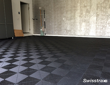 Black garage flooring using Ribtrax Pro tiles from Swisstrax