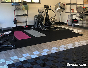 Vinyltrax Pro and Ribtrax Pro tiles installed in a basement gym